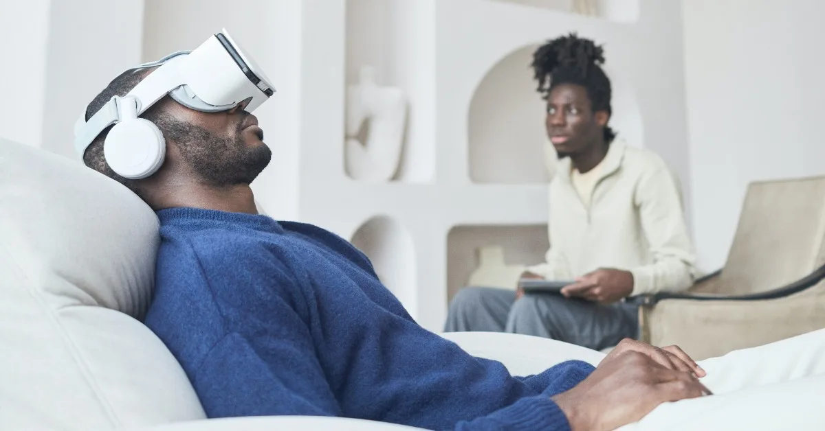 African man using AI VR Headset for medical consultation with African doctor present