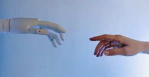 AI robot reaches to touch human outstretched hand