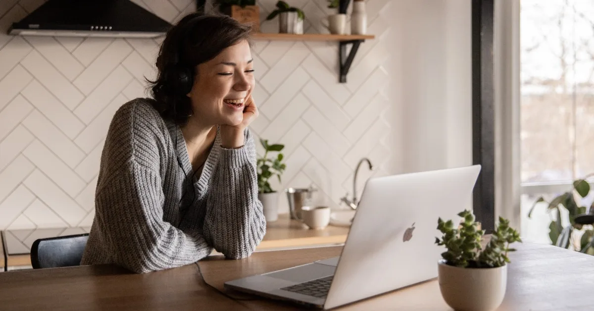 Woman laughs reading content on Googles Perspectives