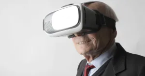 elderly ma embraces innovative VR headset with a smile