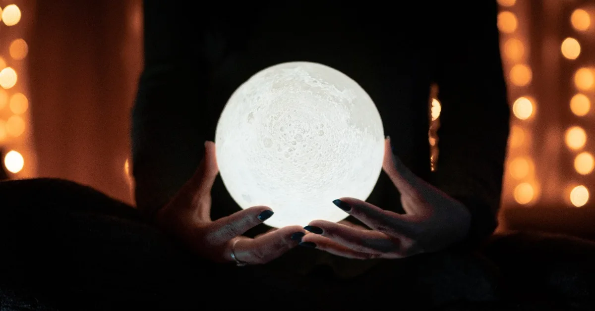 Woman holds crystal ball and predicts like AI